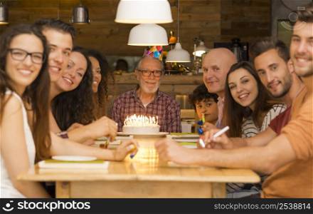 Big family celebrate the birthday of the grandfather