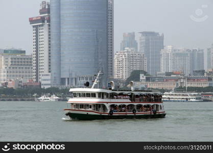 Big ferry crossing the water near Xiamen, China