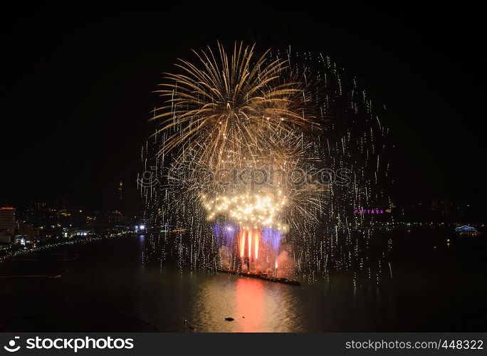 Big firework on the sky at Pattaya coast with cityscape background, Thailand