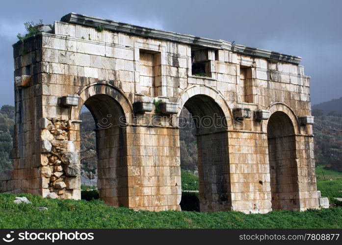 Big gate and green grass in Patara, Turkey