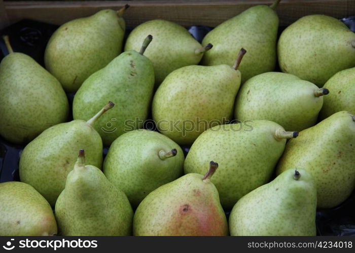 Big green pears at a market stall in the Provence, France