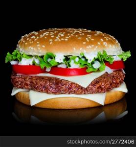 Big hamburger isolated on black backgound with reflection