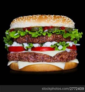 Big hamburger isolated on black backgound with reflection