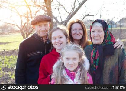 big happy family. portrait of smiling senior man and granddaughter with great granddaughters