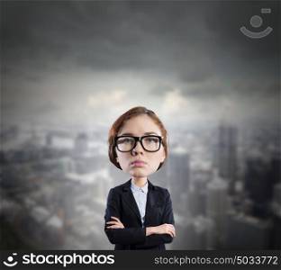 Big head. Funny young businesswoman with big head wearing glasses