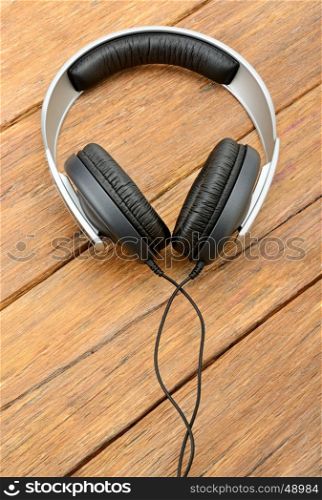 Big headphones on wooden table