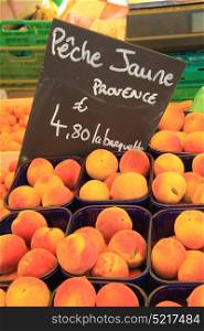 Big juicy peaches on a french market