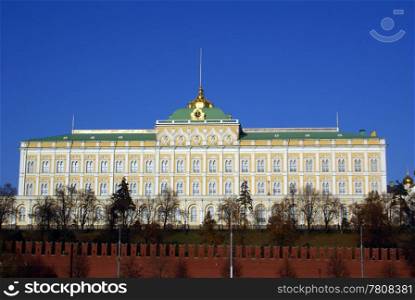 Big Kremlin palace and red wall in Moscow, Russia