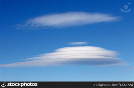 Big lenticularis cloud with a blue sky of background