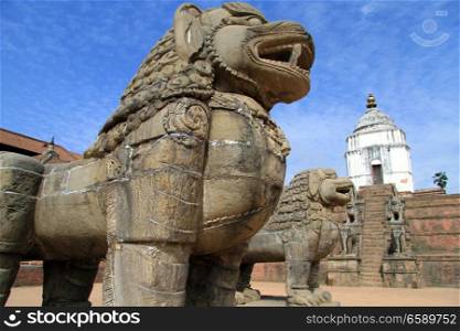 Big lions and temple in durbar square in Bhaktapur in Nepal