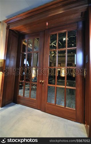 big massive luxury wood door in hotel restaurant caffee