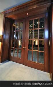big massive luxury wood door in hotel restaurant caffee