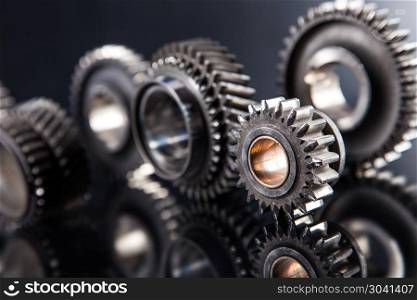 Big metal gears. Big metal gears on glossy black background