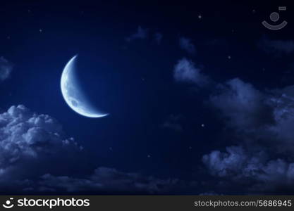 Big moon and stars in a cloudy night blue sky. fantastic beautiful landscape