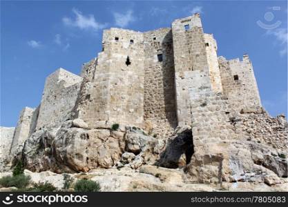 Big old castle Masyaf on the hill in Syria