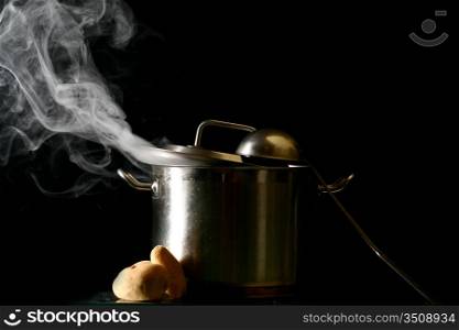 big pan and smoke on black