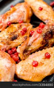 big pieces of grilled chicken, with cranberries, macro