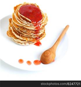 Big pile of tasty pancakes with sweet strawberry syrup on the plate isolated on white background, perfect food for morning meal