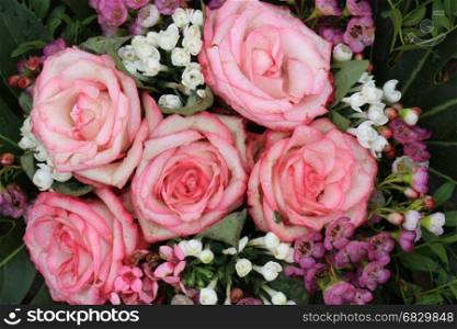 Big pink roses in a floral wedding decoration