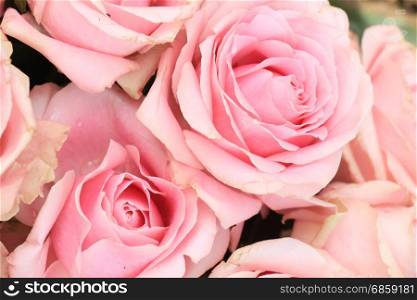 Big pink roses in a floral wedding decoration