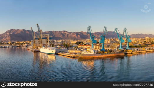 Big port cargo cranes in Palermo, Italy in a beautiful summer day