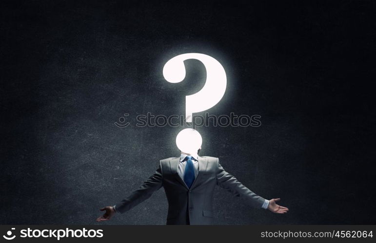 Big question. Businessman with hands spread apart looking above at big question