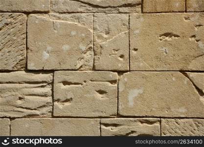 Big rectangle masonry stones on a wall, fake stone