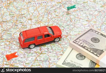 big red car and money on map of Europe