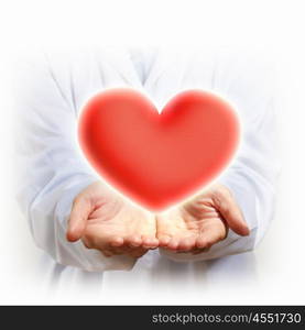 big red heart. A Big Red Heart in thehand of a person