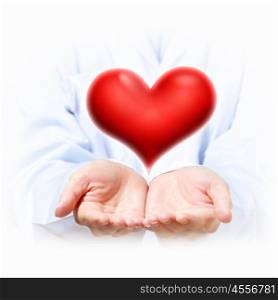 big red heart. A Big Red Heart in thehand of a person