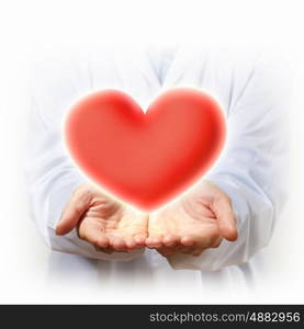 big red heart. A Big Red Heart in thehand of a person