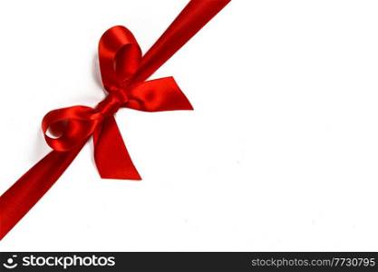 Big red satin bow isolated on white background. Christmas holiday gift concept. Red bow on white background