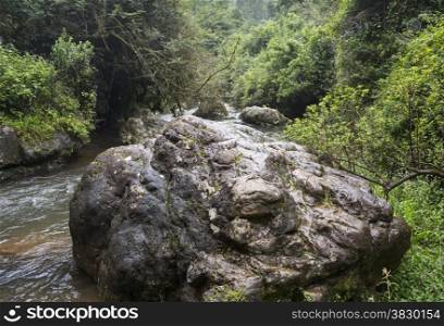 big rock in river from the waterfall near Sabie south Africa in hazyview area