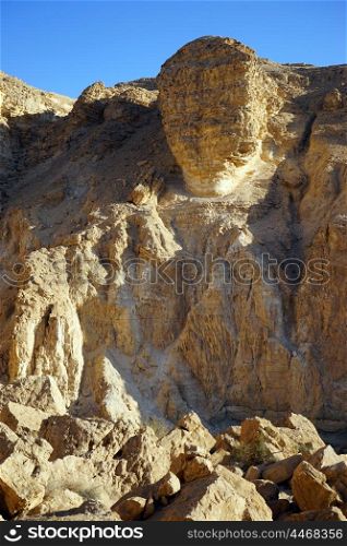 Big rock on the edge in Negev desert, Israel