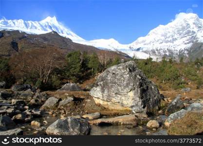 Big rocks and mountain river near Manaslu in Nepal