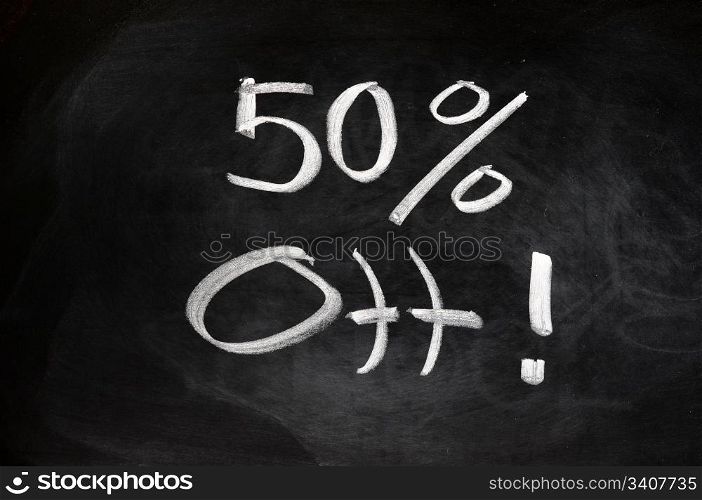 Big sale of 50 percent off written on blackboard