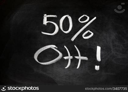 Big sale of 50 percent off written on blackboard