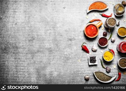 Big set of aromatic spices. On a stone background.. Big set of aromatic spices