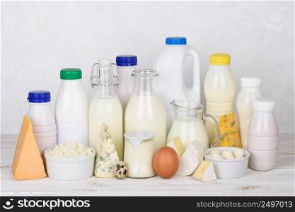 Big set of dairy products on white wooden table still life