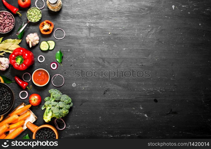 Big set organic food. Fresh raw vegetables. On a black chalkboard.. Big set organic food. Fresh raw vegetables.