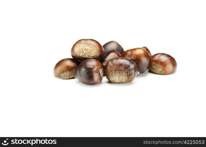 big shiny chestnuts isolated on white