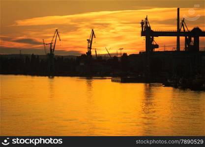 Big shipyard crane at sunset in Gdansk, Poland. Industry view.