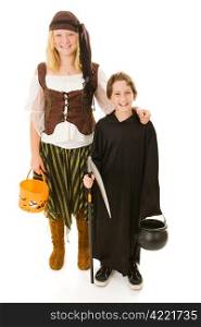 Big sister ready to take her little brother trick or treating on Halloween. Full body isolated on white.