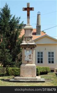 Big stone cross near church in Sombor, Serbia