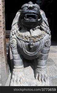 Big stone lion in buddhist temple in Patan, Nepal