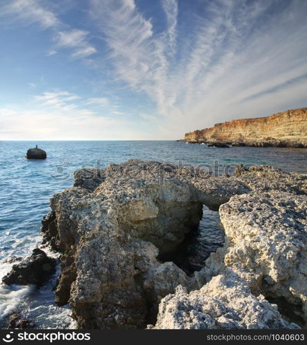 Big stone on the sea shore. Nature composition.