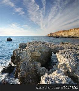 Big stone on the sea shore. Nature composition.