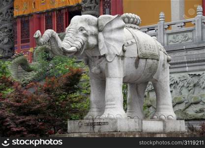 Big stone white elephant near temple in Jiuhua Shan, China