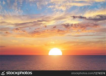 Big sun and sea sunset background. Nature composition.