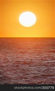 Big sun on the sea. Nature composition.